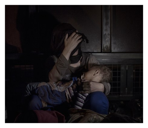 Sham, 1 year old Roszke/Horgos. In the very front, just alongside the border between Serbia and Hungary by the 4-meter-high iron gate, Sham is laying in his mother’s arms. Just a few decimeters behind them is the Europe they so desperately are trying to reach. Only one day before, the last refugees were allowed through and taken by train to Austria. But Sham and his mother arrived too late, along with thousands of other refugees who now wait outside the closed Hungarian border.